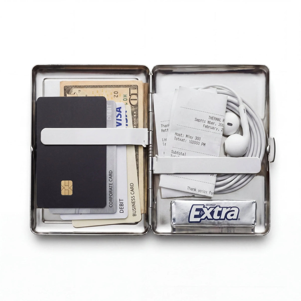 Porte-cartes en métal ArtCase ouvert, avec les essentiels à l'intérieur