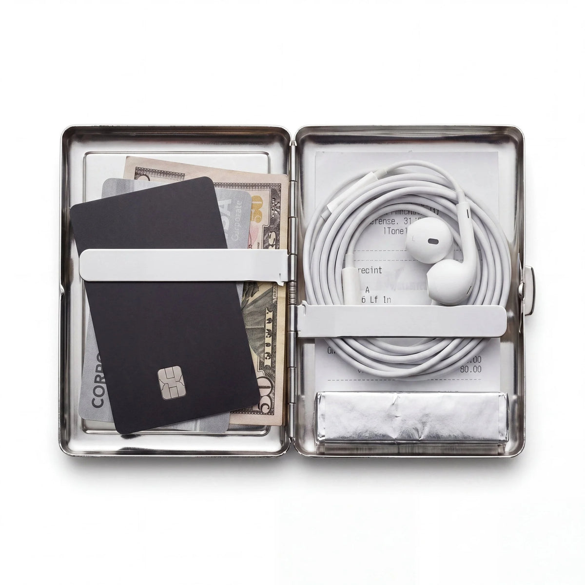 Porte-cartes en métal ArtCase ouvert, avec les essentiels à l'intérieur